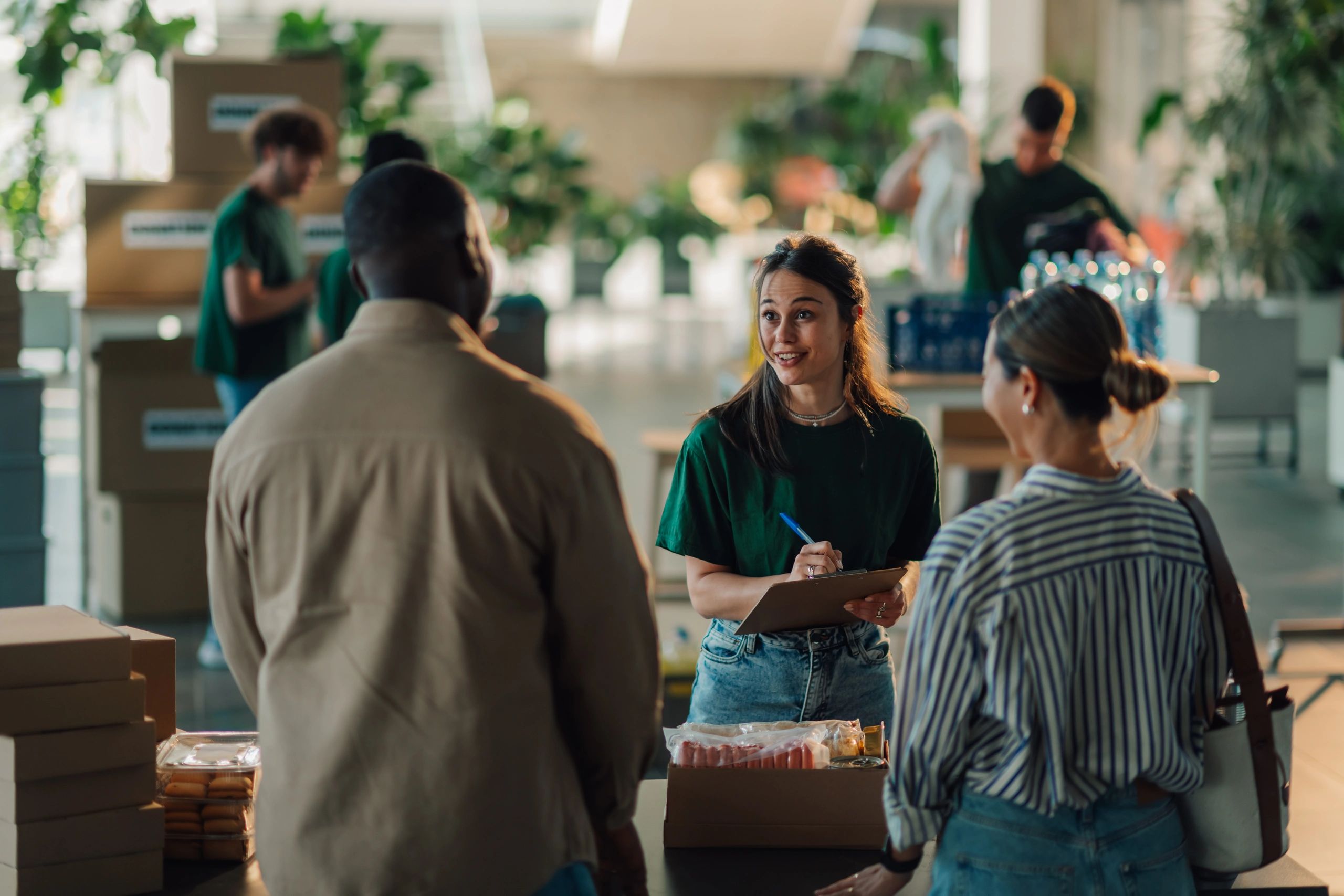 Volunteers preparing food donations for people in need